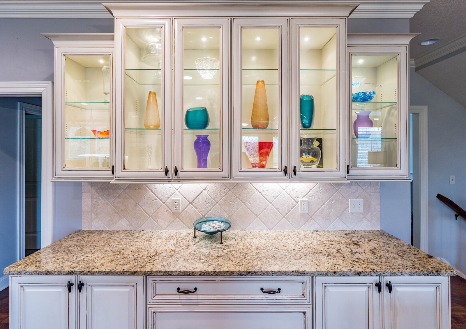 custom glass and woodwork in cabinetry for kitchen and bath interior design