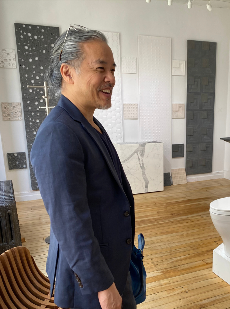 NYC interior designer standing inside a bathroom showroom